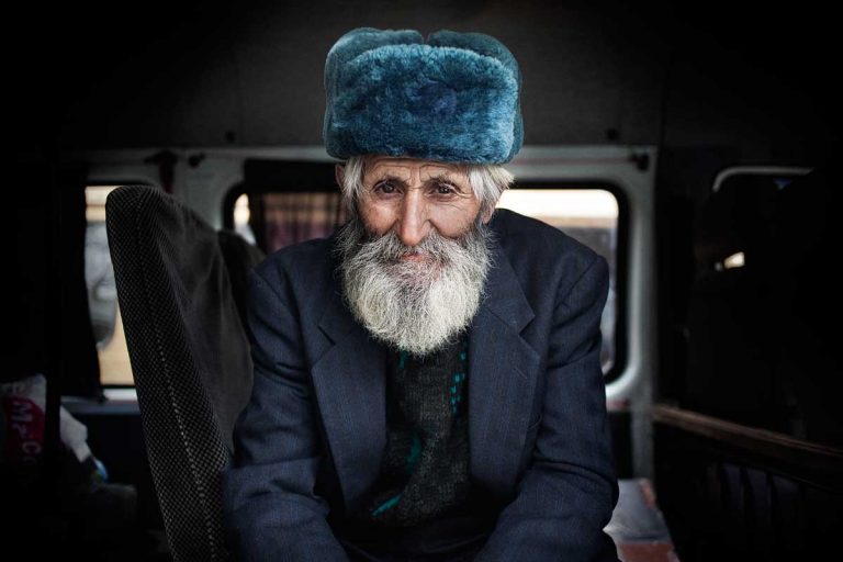 Bus station in Stepanakert. An old man waiting for the bus to leave.